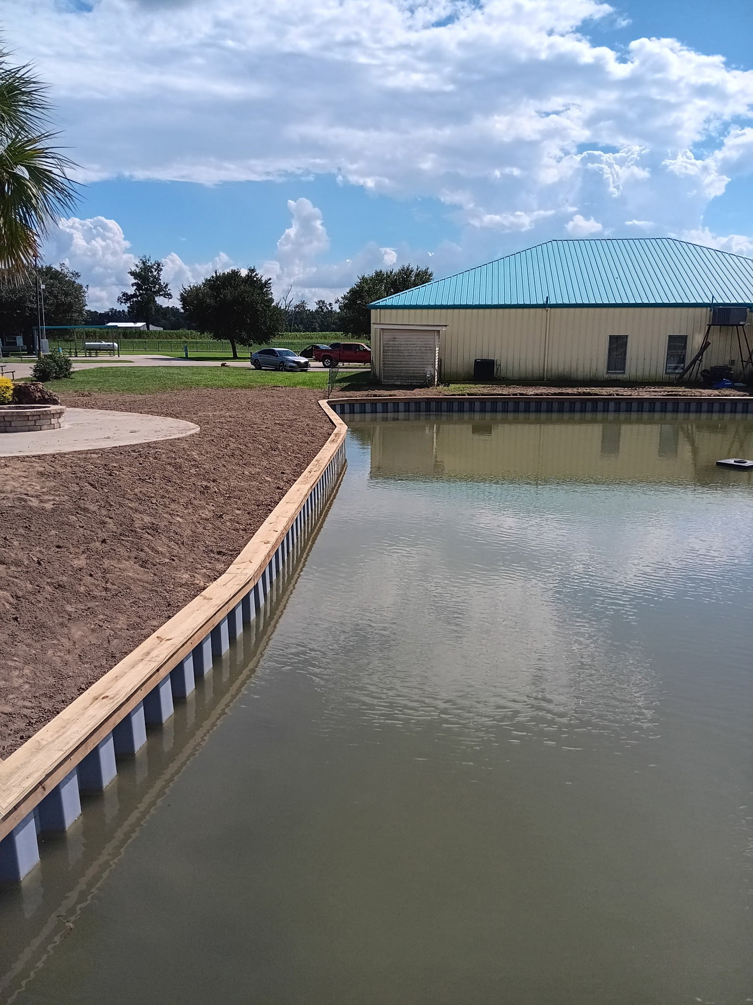 Sheet pile bulkhead with timber cap, Louisiana Sheet pile bulkhead finished with a timber cap protecting a Louisiana lake bank