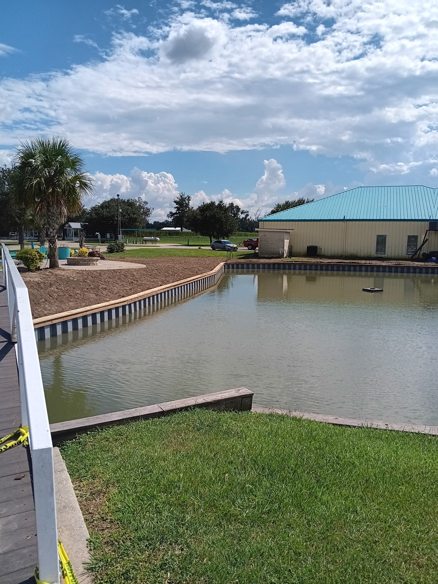 Timber capped bulkhead running the length of a lake edge in South Louisiana